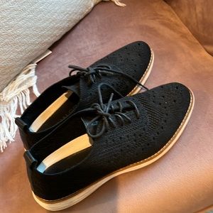 Black Cole Haan wingtip sneakers